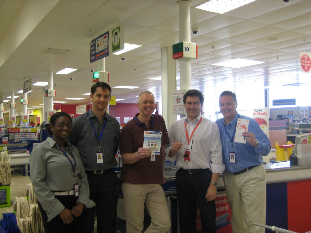 A team of 5 people after having completed training on the Tesco checkout.