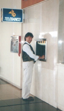 Withdrawing cash at an ATM in Alicante Airport