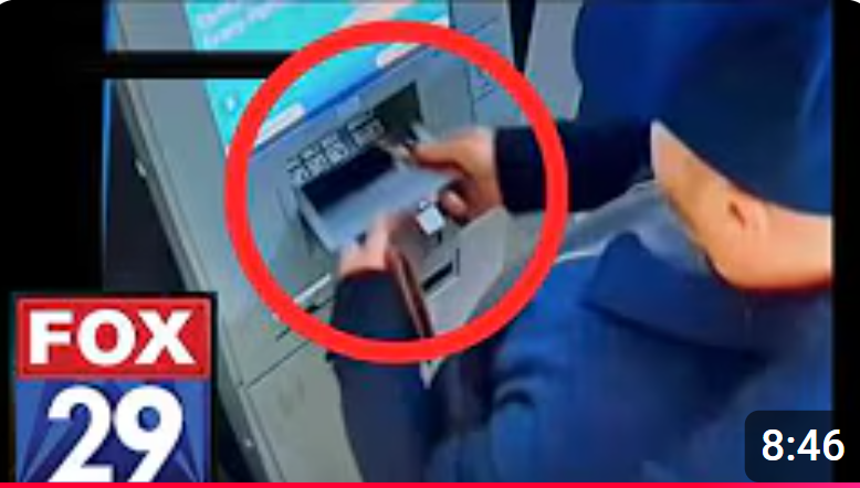 youtube screenshot of ATM skimmer being inserted