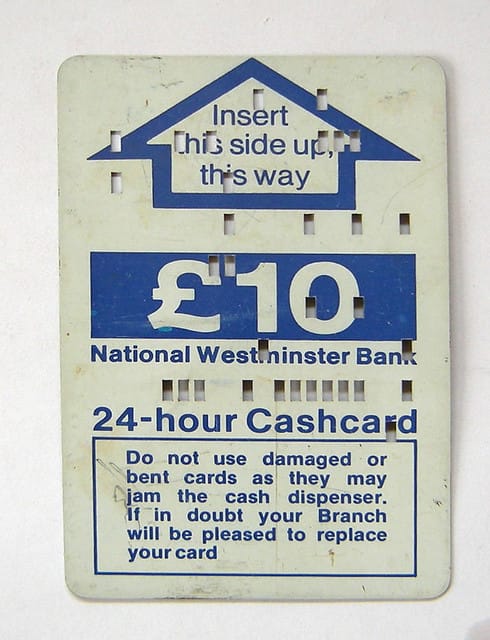 a ten pound ATM card from the 1960s with computer perforations